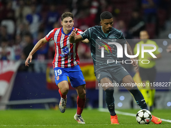 Benjamin Henrichs right-back of RB Leipzig and Germany and Julian Alvarez centre-forward of Atletico de Madrid and Argentina compete for the...