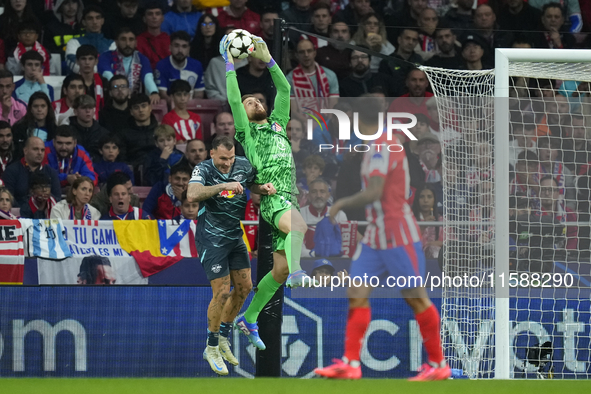 Jan Oblak goalkeeper of Atletico de Madrid and Slovenia and David Raum left-Back of RB Leipzig and Germany compete for the ball during the U...