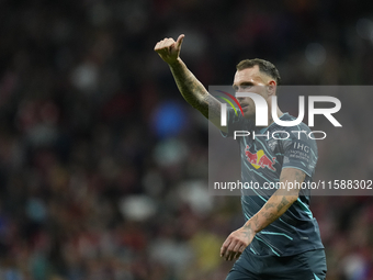 David Raum left-Back of RB Leipzig and Germany reacts during the UEFA Champions League 2024/25 League Phase MD1 match between Atletico de Ma...