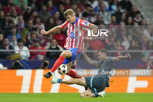 Alexander Sorloth centre-forward of Atletico de Madrid and Norway and David Raum left-Back of RB Leipzig and Germany compete for the ball du...