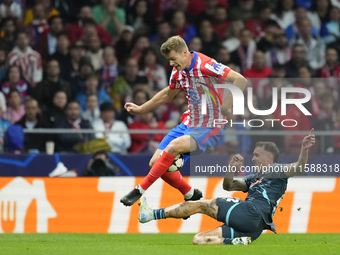 Alexander Sorloth centre-forward of Atletico de Madrid and Norway and David Raum left-Back of RB Leipzig and Germany compete for the ball du...