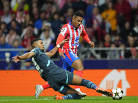 Samuel Lino left winger of Atletico de Madrid and Brazil and Benjamin Henrichs right-back of RB Leipzig and Germany compete for the ball dur...