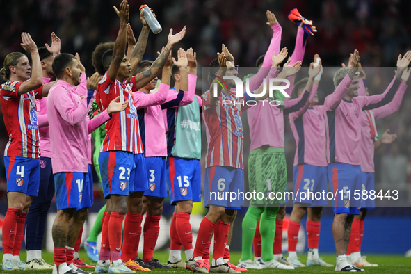 Atletico players celebrate victory after the UEFA Champions League 2024/25 League Phase MD1 match between Atletico de Madrid and RB Leipzig...