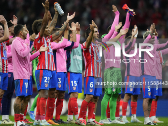 Atletico players celebrate victory after the UEFA Champions League 2024/25 League Phase MD1 match between Atletico de Madrid and RB Leipzig...