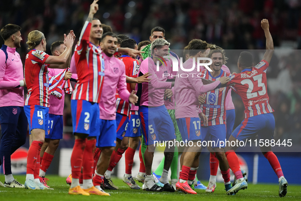 Atletico players celebrate victory after the UEFA Champions League 2024/25 League Phase MD1 match between Atletico de Madrid and RB Leipzig...