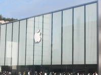 Customers line up outside the Apple flagship store as they wait to enter the store to buy the iPhone 16 in Hangzhou, China, on September 20,...