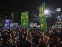 Protesters hold placards during the protest in Dhaka, Bangladesh, on September 19, 2024, against Bengali settler attacks on the Indigenous c...