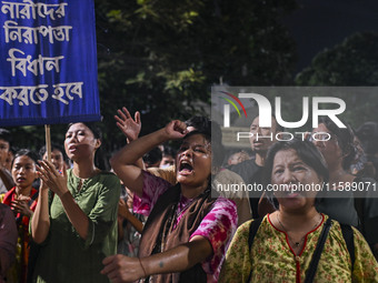 Protesters hold placards during the protest in Dhaka, Bangladesh, on September 19, 2024, against Bengali settler attacks on the Indigenous c...