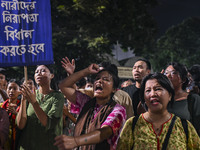 Protesters hold placards during the protest in Dhaka, Bangladesh, on September 19, 2024, against Bengali settler attacks on the Indigenous c...