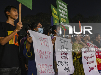 Protesters hold placards during the protest in Dhaka, Bangladesh, on September 19, 2024, against Bengali settler attacks on the Indigenous c...