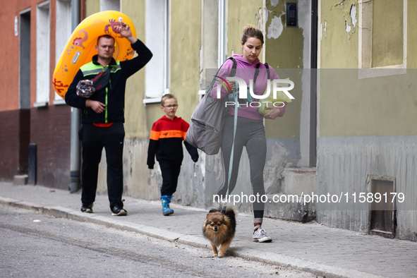 Residents are seen after Nysa Klodzka river flooded town of Lewin Brzeski in southwestern Poland, on September 19th, 2024. Storm Boris has c...