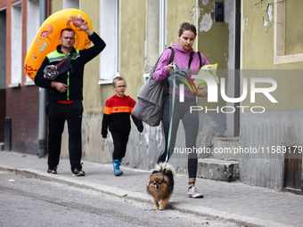 Residents are seen after Nysa Klodzka river flooded town of Lewin Brzeski in southwestern Poland, on September 19th, 2024. Storm Boris has c...