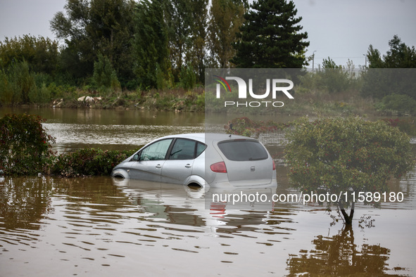 A car is seen in the water after Nysa Klodzka river flooded town of Lewin Brzeski in southwestern Poland, on September 19th, 2024. Storm Bor...