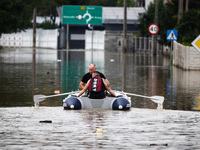 Men swim on a raft after Nysa Klodzka river flooded town of Lewin Brzeski in southwestern Poland, on September 19th, 2024. Storm Boris has c...