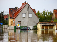 A car is seen in the water after Nysa Klodzka river flooded town of Lewin Brzeski in southwestern Poland, on September 19th, 2024. Storm Bor...