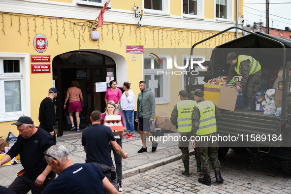 Volunteers and emergency personel provides aid for the residents after Nysa Klodzka river flooded town of Lewin Brzeski in southwestern Pola...