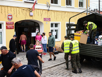 Volunteers and emergency personel provides aid for the residents after Nysa Klodzka river flooded town of Lewin Brzeski in southwestern Pola...