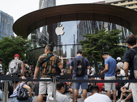 People who order the latest iPhone model lineup outside an Apple store in Bangkok, Thailand, on September 20, 2024. Apple now makes availabl...