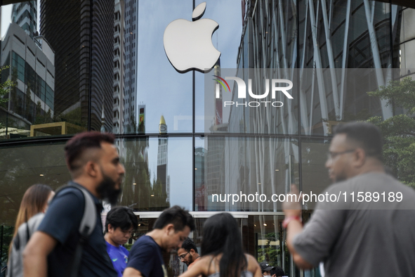 People who order the latest iPhone model lineup outside an Apple store in Bangkok, Thailand, on September 20, 2024. Apple now makes availabl...