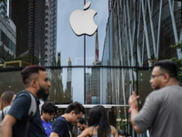 People who order the latest iPhone model lineup outside an Apple store in Bangkok, Thailand, on September 20, 2024. Apple now makes availabl...