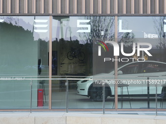 A new electric car is displayed at a new Tesla store in Shanghai, China, on August 9, 2024. (