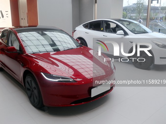 New electric cars are displayed at a new Tesla store in Shanghai, China, on August 9, 2024. (