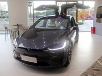 A new electric car is displayed at a new Tesla store in Shanghai, China, on August 9, 2024. (