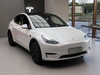 A new electric car is displayed at a new Tesla store in Shanghai, China, on August 9, 2024. (