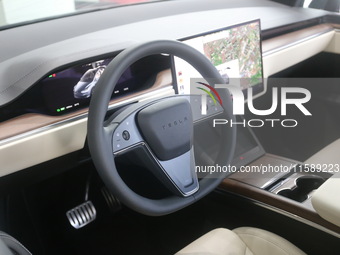 A new electric car is displayed at a new Tesla store in Shanghai, China, on August 9, 2024. (