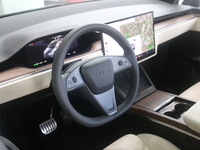 A new electric car is displayed at a new Tesla store in Shanghai, China, on August 9, 2024. (