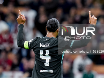 Virgil van Dijk of Liverpool FC celebrates during the UEFA Champions League 2024/25 League Phase MD1 match between AC Milan and Liverpool FC...