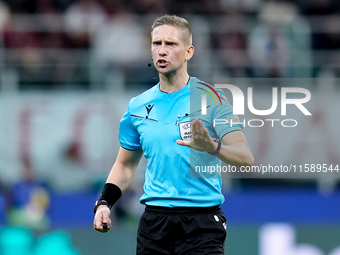 Referee Espen Eskas gestures during the UEFA Champions League 2024/25 League Phase MD1 match between AC Milan and Liverpool FC at Stadio San...