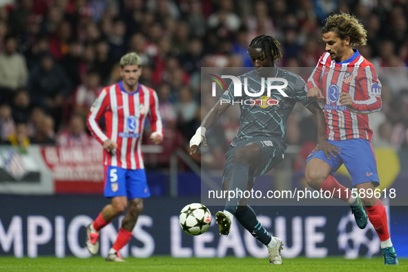 Amadou Haidara central midfield of RB Leipzig and Mali and Antoine Griezmann second striker of Atletico de Madrid and France compete for the...