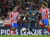 Amadou Haidara central midfield of RB Leipzig and Mali and Antoine Griezmann second striker of Atletico de Madrid and France compete for the...