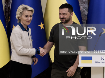 European Commission President Ursula Von Der Leyen shakes hands with Ukrainian President Volodymyr Zelenskiy after a joint press conference...