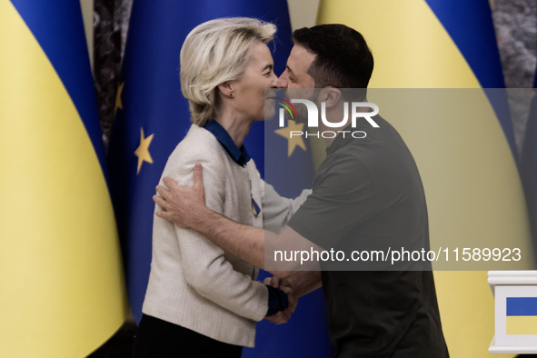 European Commission President Ursula Von Der Leyen shakes hands with Ukrainian President Volodymyr Zelenskiy after a joint press conference...