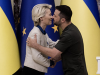 European Commission President Ursula Von Der Leyen shakes hands with Ukrainian President Volodymyr Zelenskiy after a joint press conference...