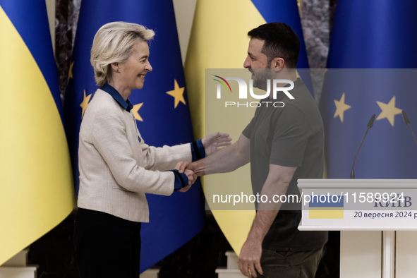 European Commission President Ursula Von Der Leyen shakes hands with Ukrainian President Volodymyr Zelenskiy after a joint press conference...