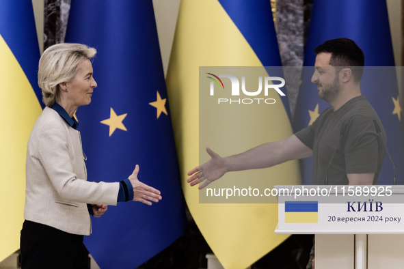 European Commission President Ursula Von Der Leyen shakes hands with Ukrainian President Volodymyr Zelenskiy after a joint press conference...