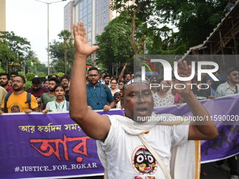 Doctors and citizens shout slogans and participate in a protest march to condemn the rape and murder of a doctor in Kolkata, India, on Septe...