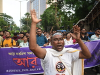 Doctors and citizens shout slogans and participate in a protest march to condemn the rape and murder of a doctor in Kolkata, India, on Septe...