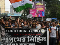 Doctors and citizens shout slogans and participate in a protest march to condemn the rape and murder of a doctor in Kolkata, India, on Septe...