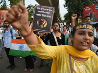 Doctors and citizens shout slogans and participate in a protest march to condemn the rape and murder of a doctor in Kolkata, India, on Septe...