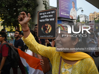 Doctors and citizens shout slogans and participate in a protest march to condemn the rape and murder of a doctor in Kolkata, India, on Septe...