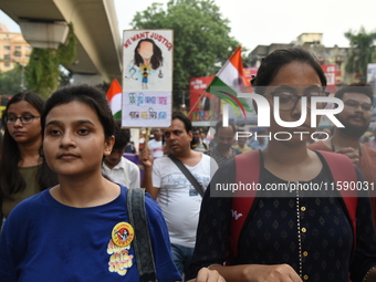 Doctors and citizens shout slogans and participate in a protest march to condemn the rape and murder of a doctor in Kolkata, India, on Septe...