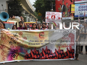 Doctors and citizens shout slogans and participate in a protest march to condemn the rape and murder of a doctor in Kolkata, India, on Septe...