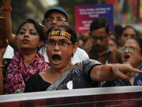 Doctors and citizens shout slogans and participate in a protest march to condemn the rape and murder of a doctor in Kolkata, India, on Septe...