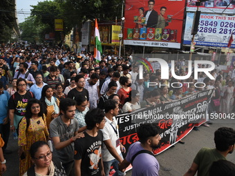 Doctors and citizens shout slogans and participate in a protest march to condemn the rape and murder of a doctor in Kolkata, India, on Septe...