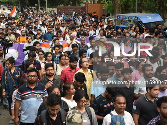 Doctors and citizens shout slogans and participate in a protest march to condemn the rape and murder of a doctor in Kolkata, India, on Septe...