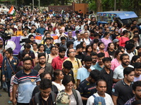 Doctors and citizens shout slogans and participate in a protest march to condemn the rape and murder of a doctor in Kolkata, India, on Septe...